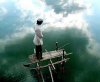 muslim-praying-on-platform-above-water.jpg